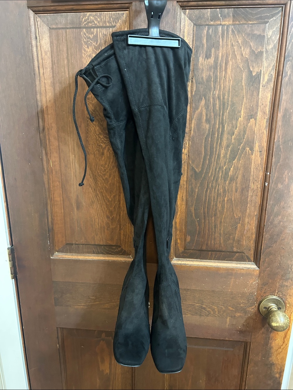 Over-the-knee suede boots hanging
Bought never wore, just tried on with a dress.